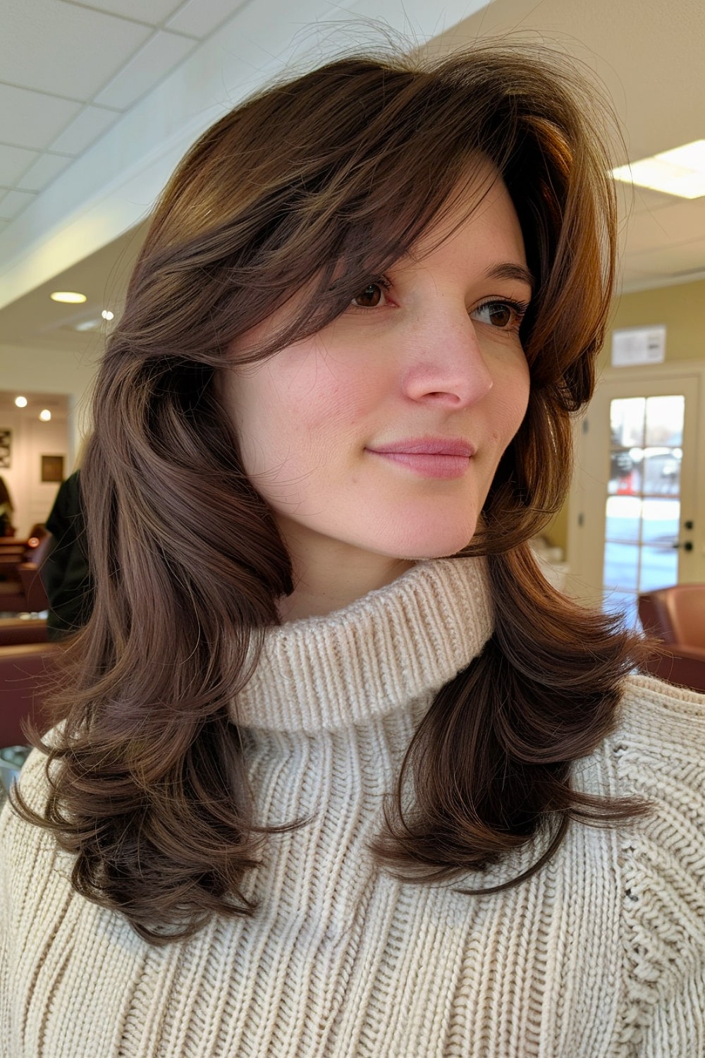 Dark brown layered hair with bangs