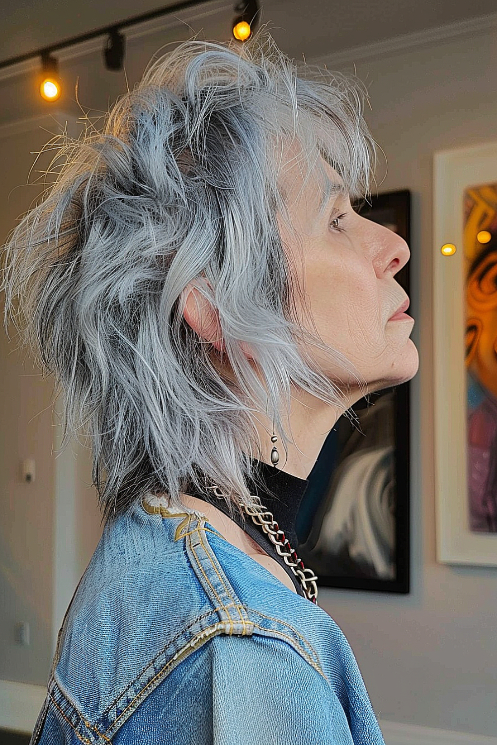 Short, choppy modern mullet with subtle gray tones for fine hair