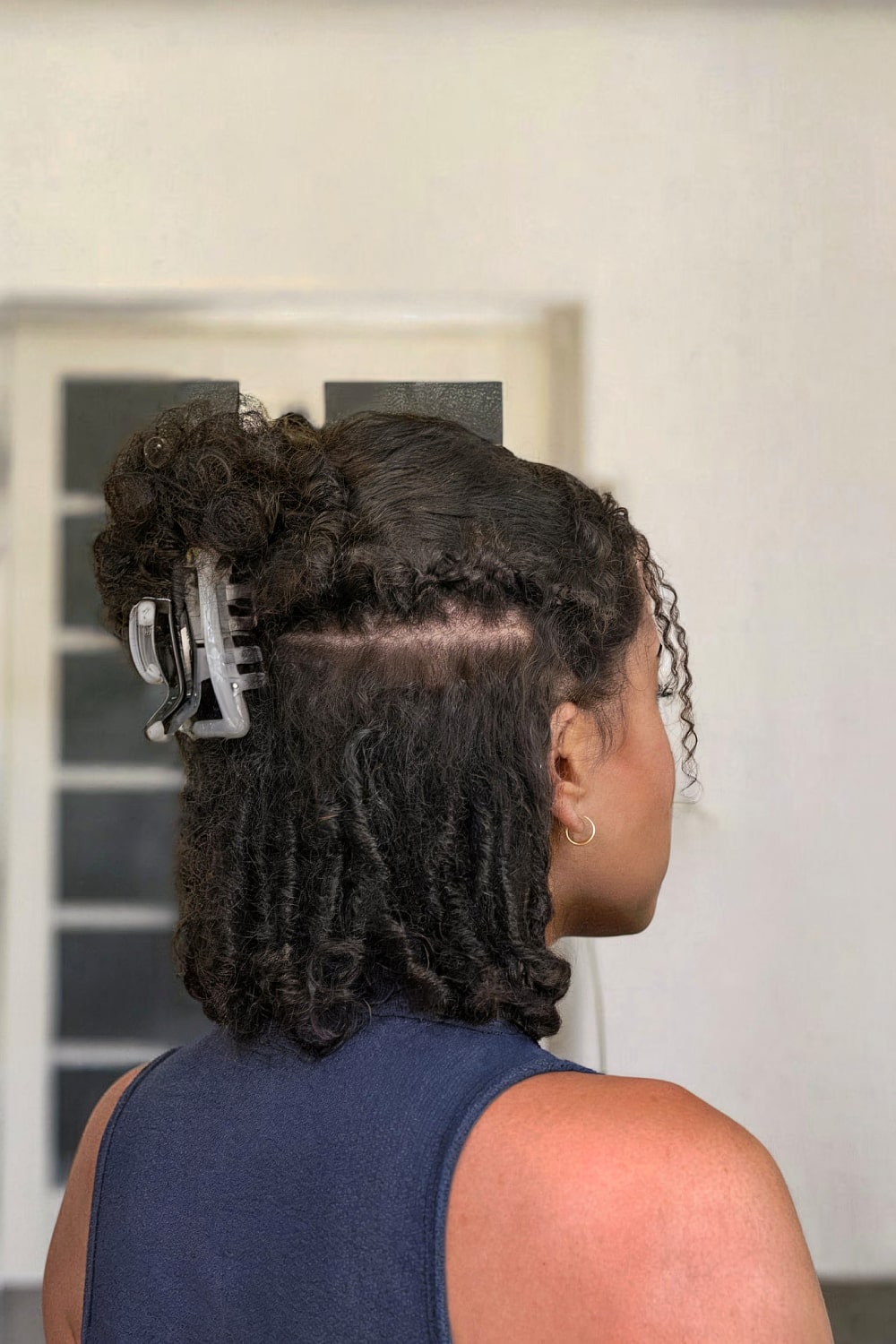 Natural curly hairstyle with claw clip