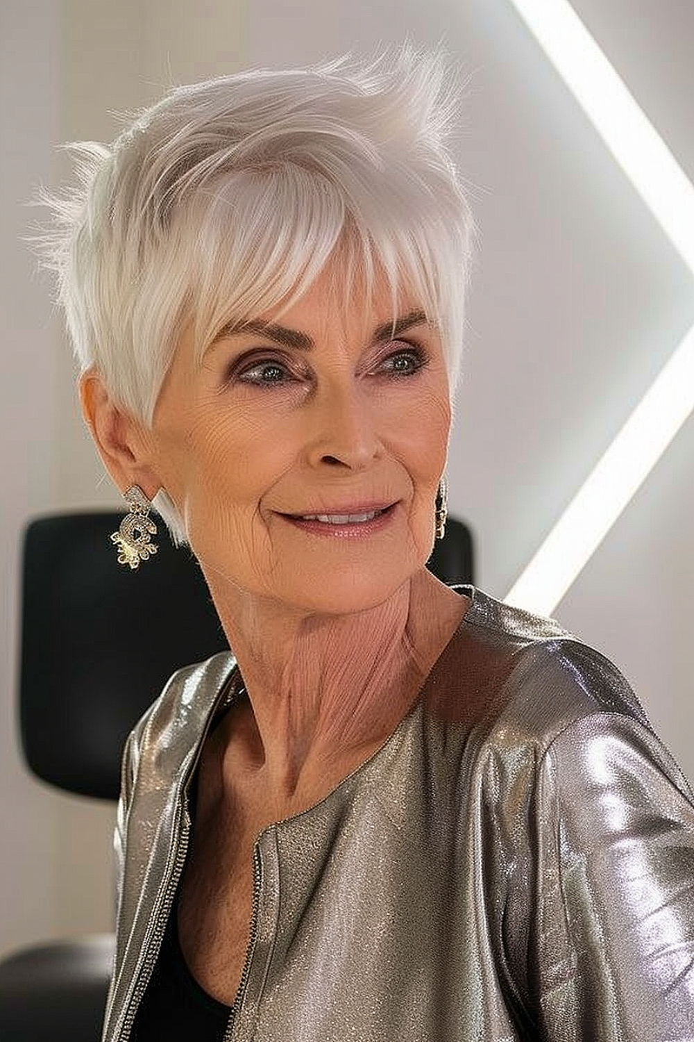 Woman with a platinum pixie cut and edgy bangs