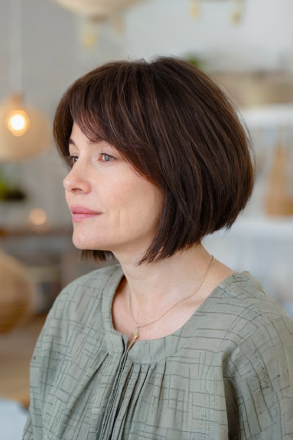 Stacked bob with wispy curtain bangs