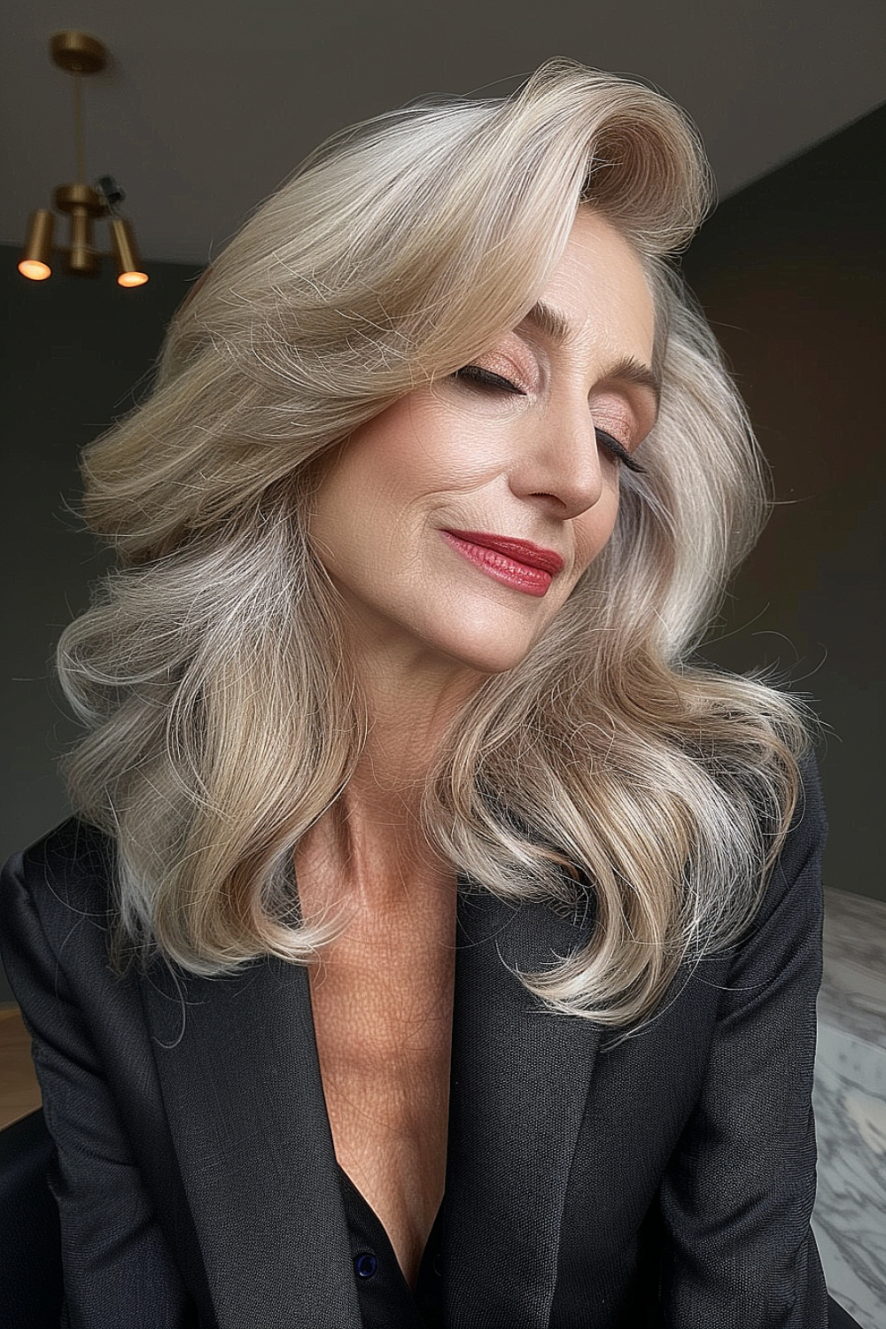 Voluminous blowout hairstyle with a deep side part